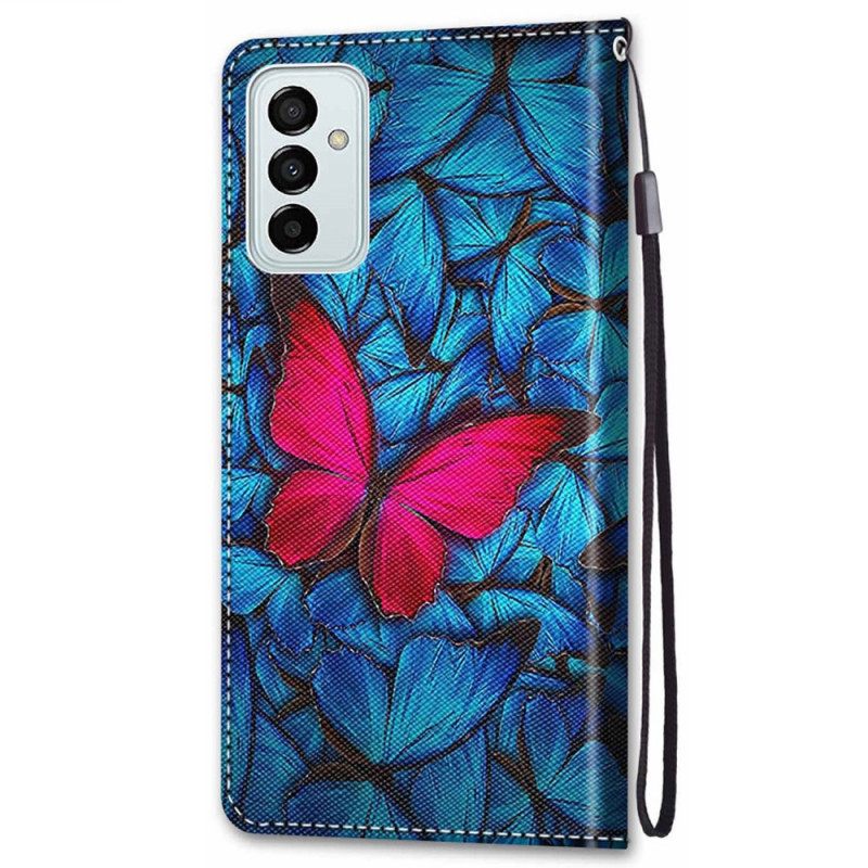 δερματινη θηκη Samsung Galaxy M23 5G Κόκκινη Πεταλούδα Σε Μπλε Φόντο