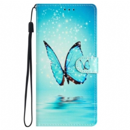 Κάλυμμα iPhone 15 με κορδονι Μπλε Πεταλούδα Σε Πτήση Με Λουράκι